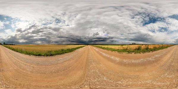 Full seamless spherical hdri panorama 360 degrees angle view on gravel road among fields with awesome clouds before storm in equirectangular projection, ready for VR AR virtual reality content — Stock Photo, Image