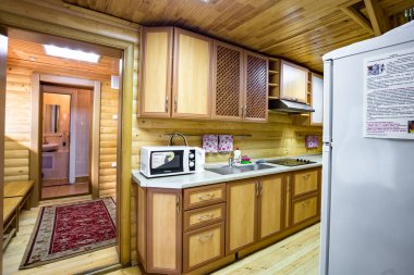 GRODNO, BELARUS - AUGUST, 2019: interior of hall interior of eco kitchen with wooden furniture clipart