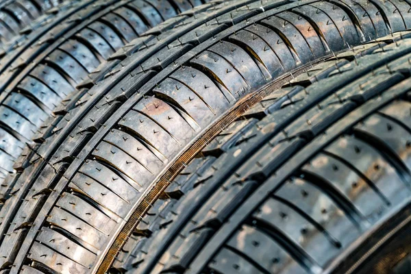 Row of car dirty tires at warehouse in tire store — Stock Photo, Image