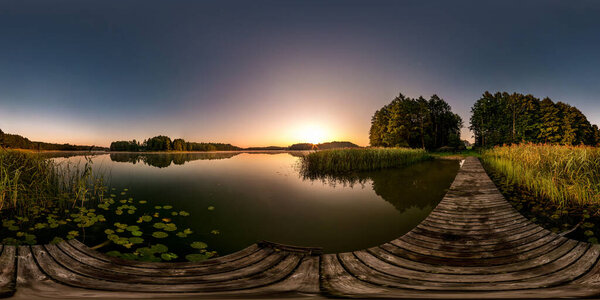 full seamless spherical hdri panorama 360 degrees  angle view on wooden pier of huge lake or river in morning with pink sunrise mist fog in equirectangular projection, VR content