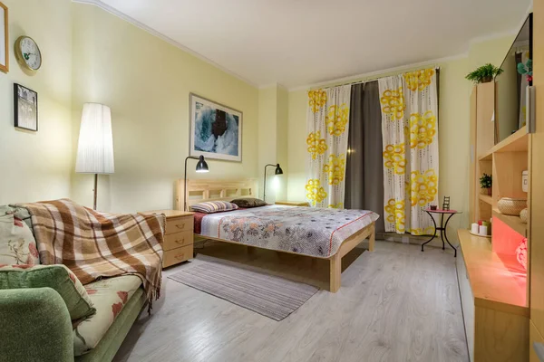 MINSK, BELARUS - SEPTEMBER, 2019: Interior of the modern luxure bedroom in studio apartments in yellow light color style — Stock Photo, Image