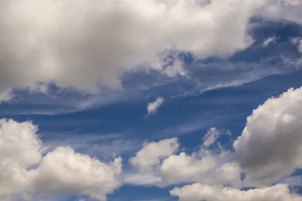 Blue sky background with white striped clouds. Clearing day and Good windy weather