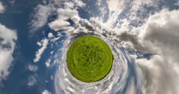 Green Tiny Planet Revolves Blue Sky White Clouds Little Planet — Stock Video