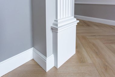 Detail of corner flooring with intricate crown molding.  clipart