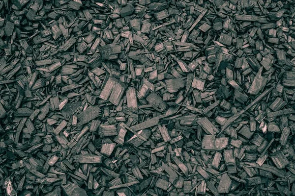Gray wood chips texture. Small gray sawdust background.