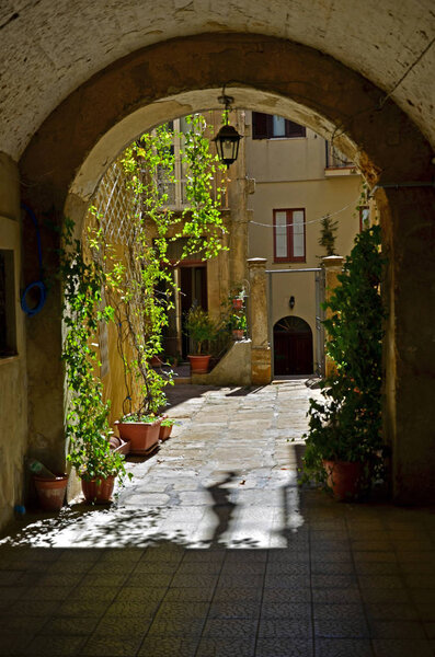 Entrance to an old courtyard in an italian town