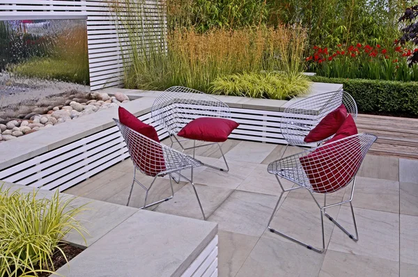 The contemporary patio area and water feature in the Relax and Reflective garden