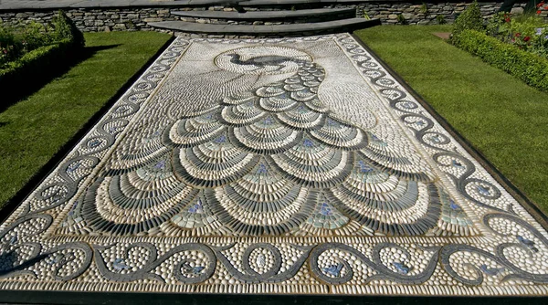 A good example of a traditional Peacock design in pebble mosaic in a garden terrace