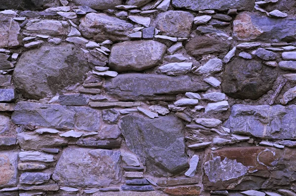 Dekorativní Kamenná stěna tvořená skalami a oblázky s nádhernou strukturou — Stock fotografie