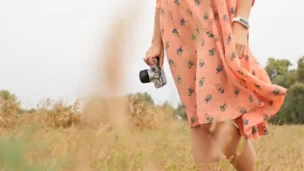 Close-up of a girl with a camera. Nice smile on face. Slow motion — Stock Video