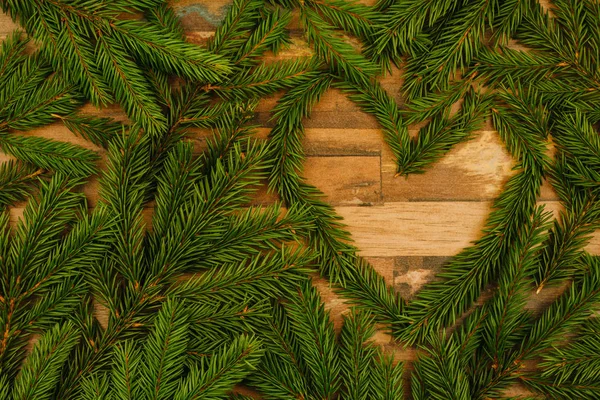 Vuren Takken Een Houten Oppervlak Kerstmis Achtergrond Hartsymbool Kopiëren Van — Stockfoto