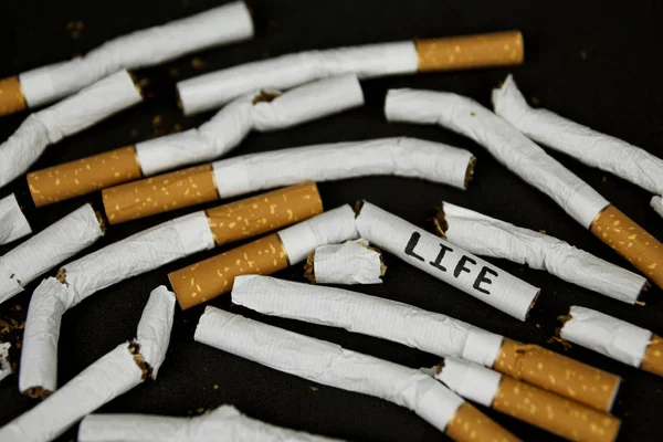 World No Tobacco Day. Stop smoking. stop cigarettes and nicotine. Cigarettes on black background