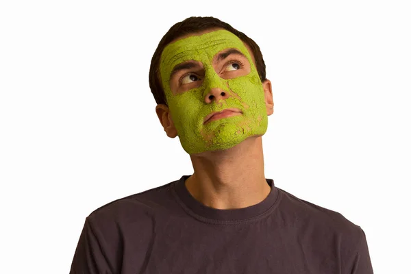 Retrato Joven Con Una Mascarilla Verde Haciendo Caras Sobre Fondo — Foto de Stock