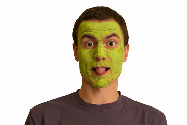 Retrato Joven Con Una Mascarilla Verde Haciendo Caras Sobre Fondo — Foto de Stock