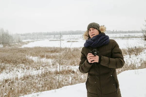 Winter portraits of a guy. Walk in nature