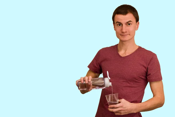 Guy Holds Bottle Water Blue Background Concept Healthy Lifestyle — Stock Photo, Image