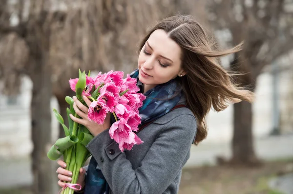 Woman with tulips. Beautiful woman with flowers.