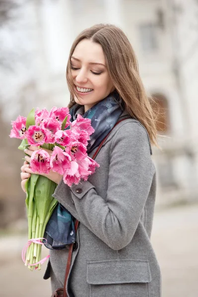 Woman with tulips. Beautiful woman with flowers.