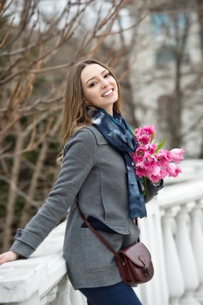 Woman with tulips. Beautiful woman with flowers.