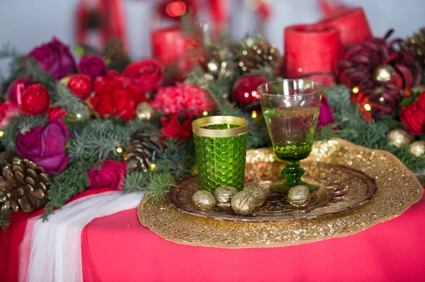 Beautifully decorated house with a tree and presents at Christmas. Red and gold decoration christmas table.