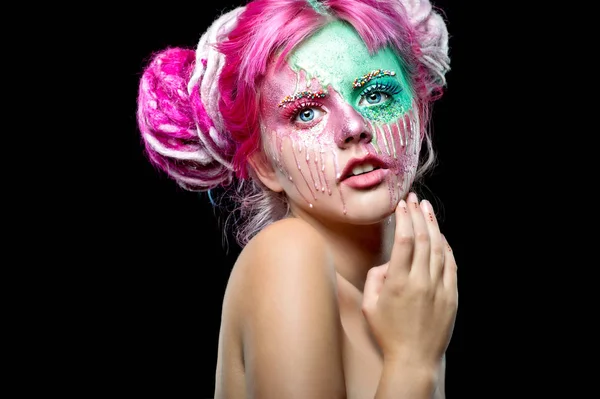 Young woman with pink dreads. Bizarre pink hair girl. Creative makeup. Halloween costume