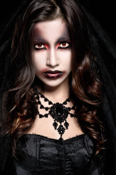 Portrait of a pale gothic vampire woman. Halloween Makeup