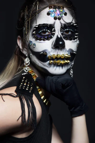 woman posing with halloween skeleton makeup