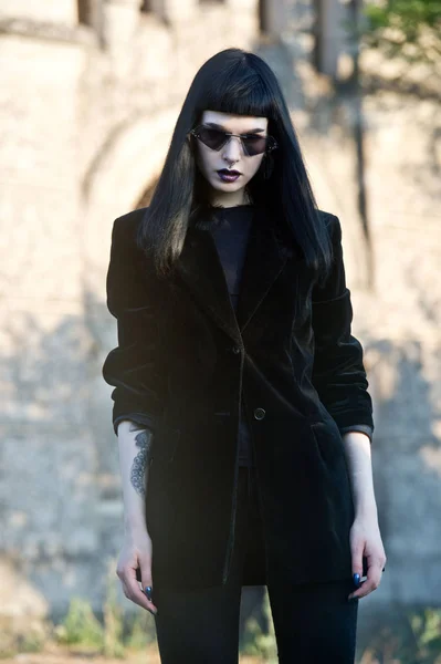 Gothic woman. Woman monster. Goth girl at the cemetery.