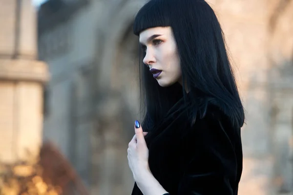 Gothic woman. Woman monster. Goth girl at the cemetery.