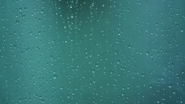 Timelapse rain drops cover wet smooth window glass surface — Stock Video