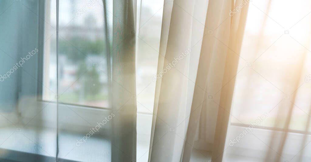 transparent curtains at blurry plastic windows back sunlight