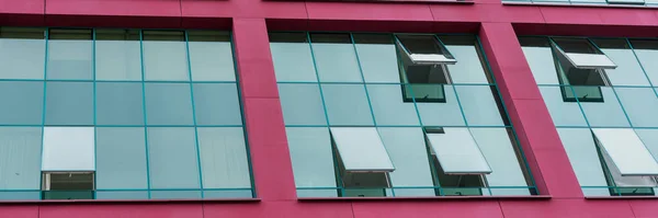 local commercial office building wall with large windows