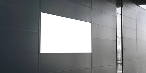 Beyaz reklam pankartı olan gri ofis duvarı.