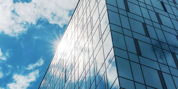La luz del sol brilla desde detrás del edificio con ventanas panorámicas Imagen de archivo