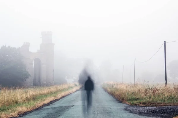 Lonely Ghostly Silhouetted Figure Walking Spooky Foggy Lane Next Ruins — Stock Photo, Image