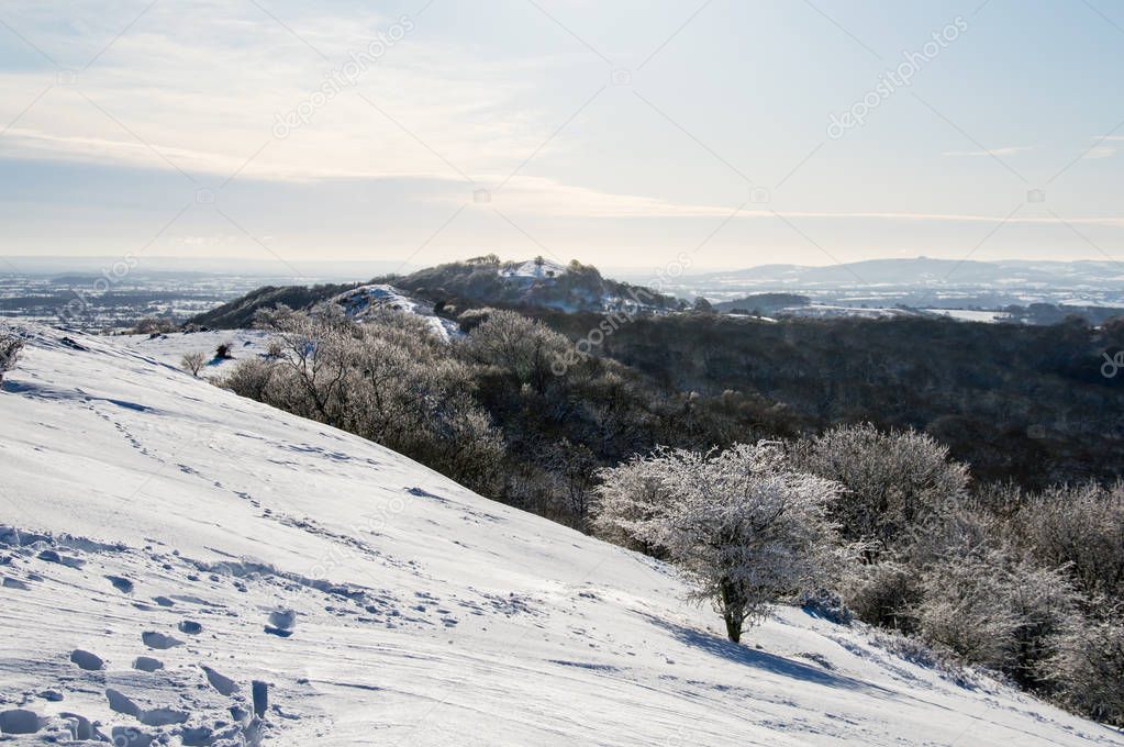 The ridge of the Malvern Hills covered in snow on a sunny winters day. England. 