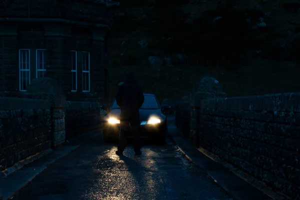 Mysterious Hooded Man Back Camera Standing Front Car Headlights Country — Stock Photo, Image