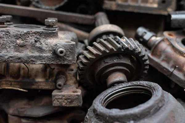 Old engine parts, steel and used car parts, for engineering. Selective focus.