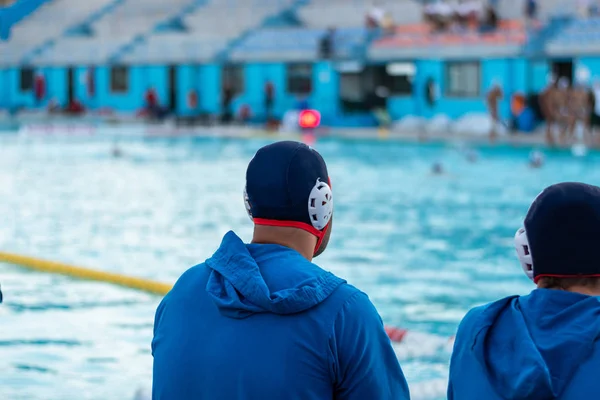 Two Water Polo Reserved Players Observing Game Sitting Bench Background — Stock Photo, Image