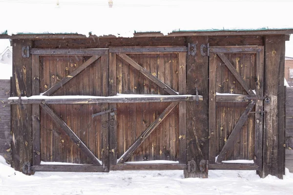 old gate in winter snow
