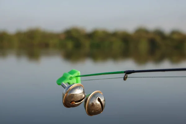 Fishing bell at the end of a fishing rod. Bells will ring when the fish is hooked.