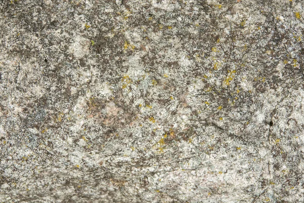 Roccia ricoperta di crepe. Struttura in pietra naturale . — Foto Stock