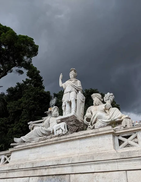 Statue in Rome before storm