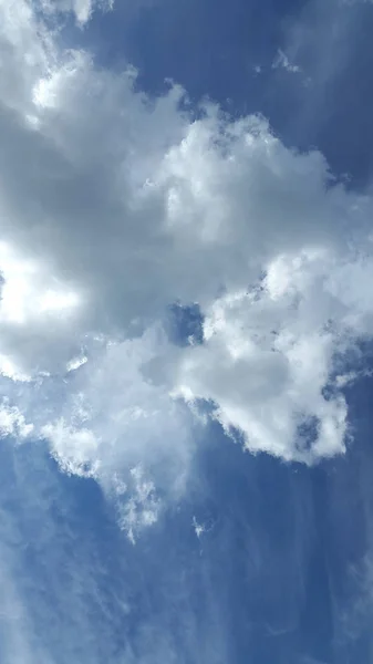 Clouds. Sky. Cloud background. Light white clouds on blue sky