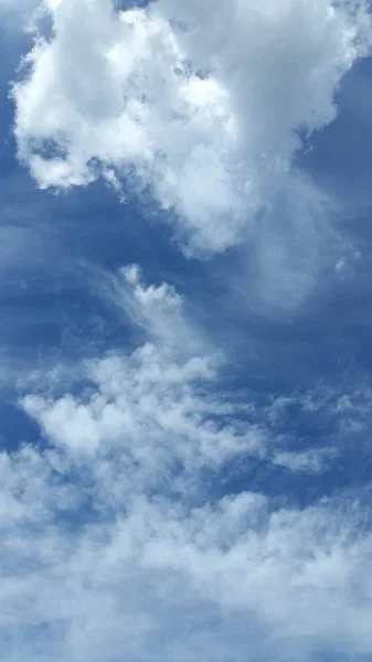 Clouds. Sky. Cloud background. Light white clouds on blue sky