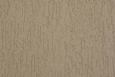Alçı. Dekoratif sıva. Grenli yüzey. Bej sıva kaplama