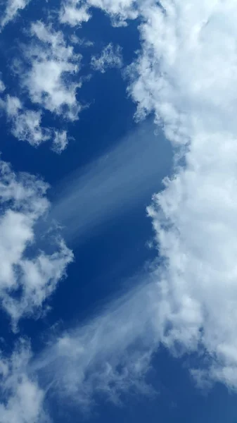 Clouds. Sky. Cloud background. Light white clouds on blue sky