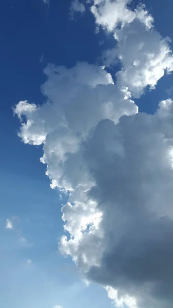 Clouds. Sky. Cloud background. Light white clouds on blue sky