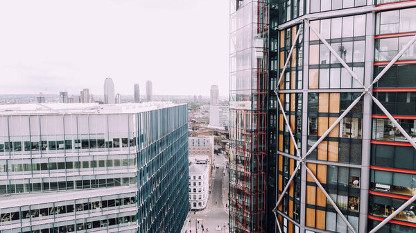 LONDON, UK - CIRCA JUNE 2019: view of business district of central London from Tate Modern observation deck on a moody day.