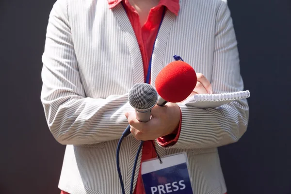 Female Journalist News Conference Writing Notes Holding Microphone — Stock Photo, Image